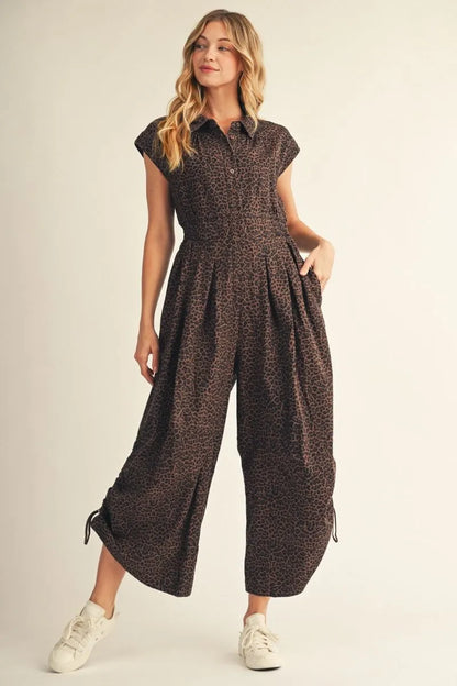 Jodifl-Drop shoulder button down wide leg leopard jumpsuit with side drawstring hem accent, front pleat detail, side pockets.