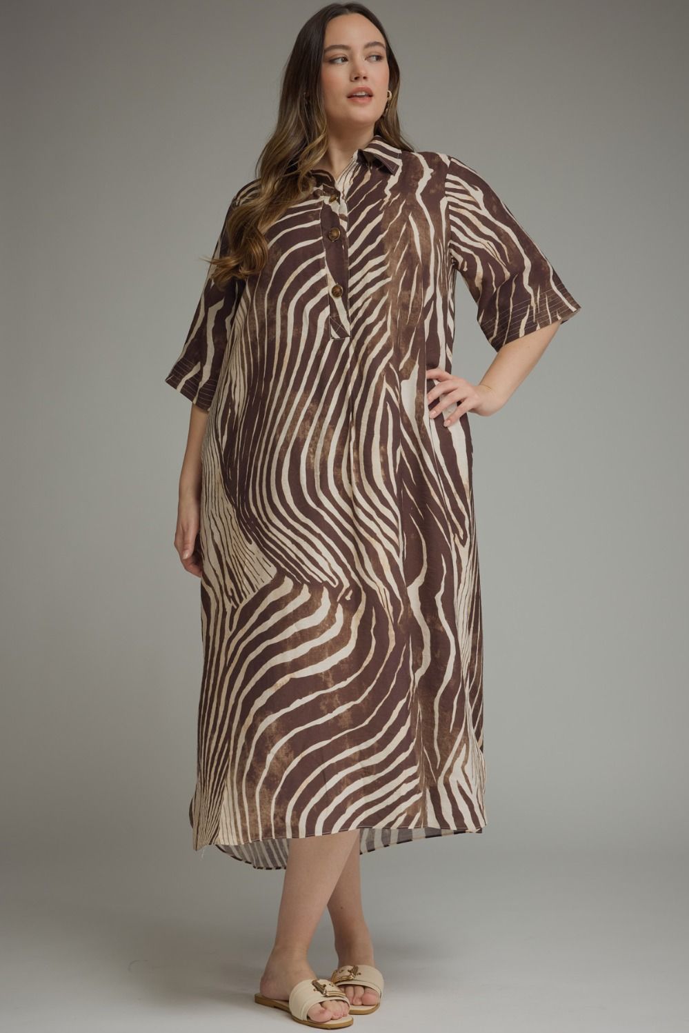 Entro-Plus Size Abstract zebra print elbow sleeve midi dress featuring a split neckline with button closure at front. Side pockets. High-low hem.