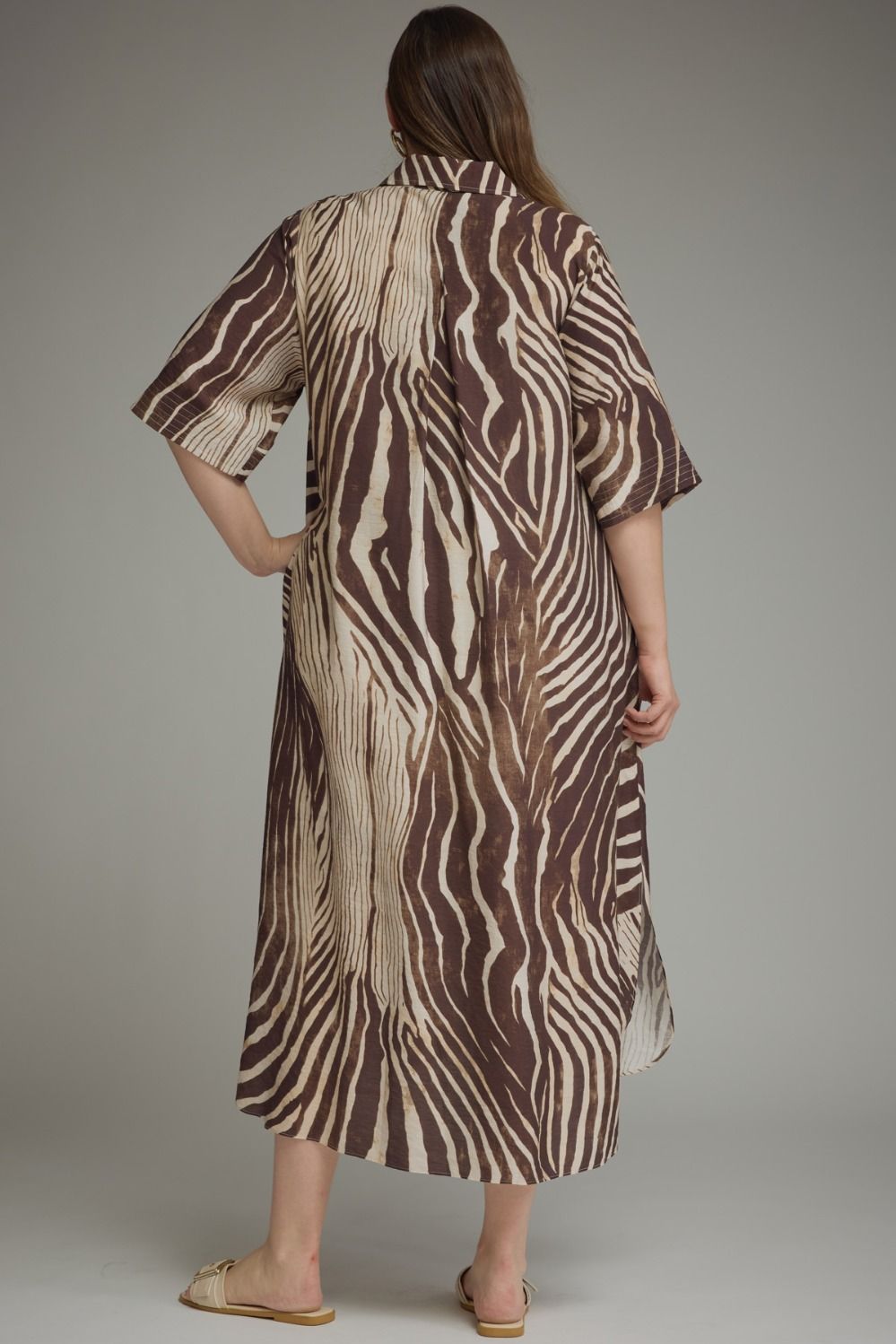 Entro-Plus Size Abstract zebra print elbow sleeve midi dress featuring a split neckline with button closure at front. Side pockets. High-low hem.