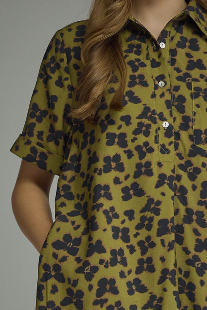 Entro-Butterfly print short sleeve mini dress featuring a button closure at front and chest pocket. Side pockets.