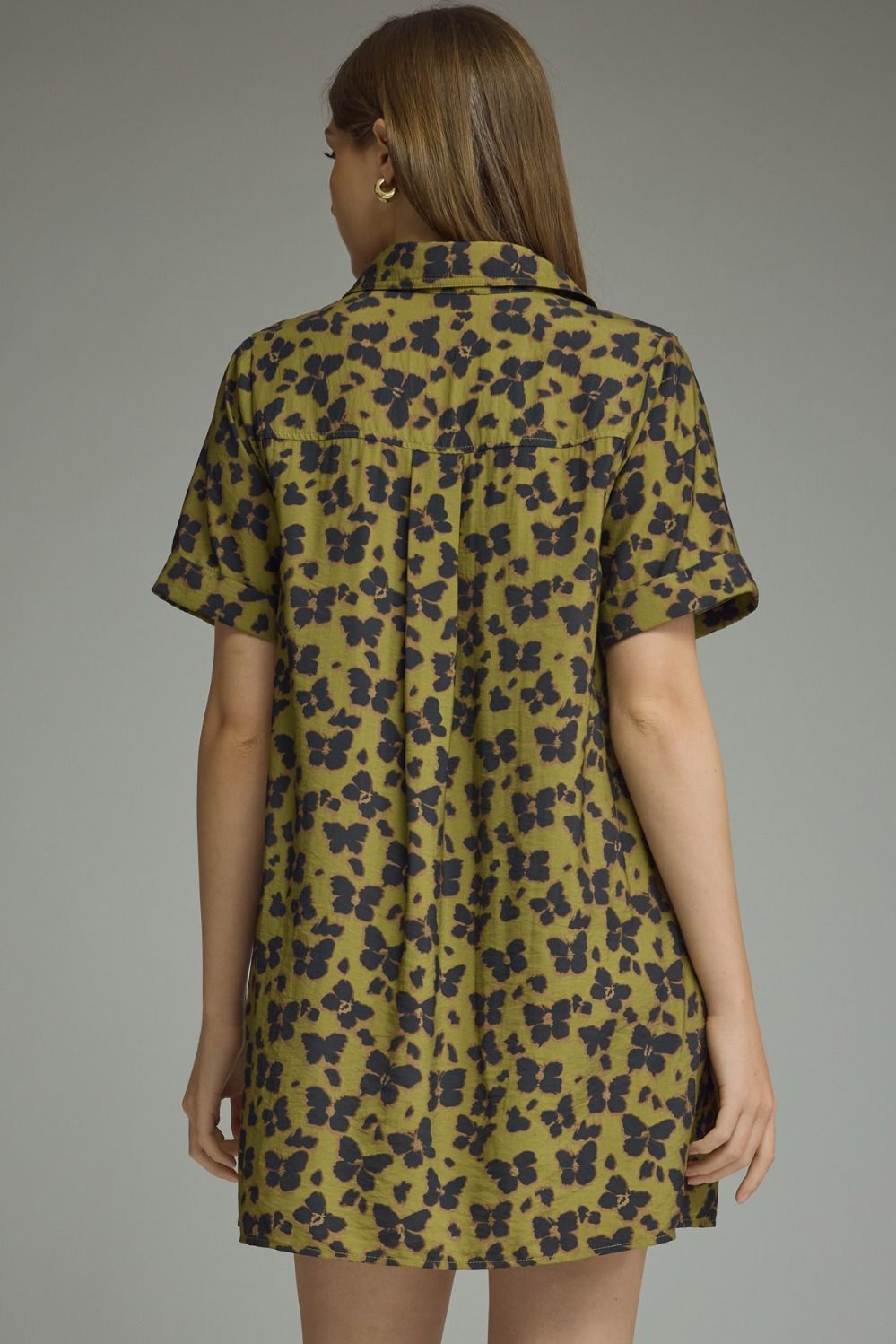 Entro-Butterfly print short sleeve mini dress featuring a button closure at front and chest pocket. Side pockets.