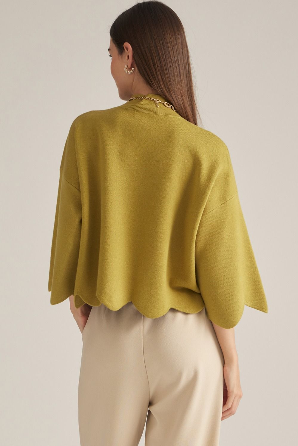Entro-Solid ¾ sleeve sweater top with a mock neck.