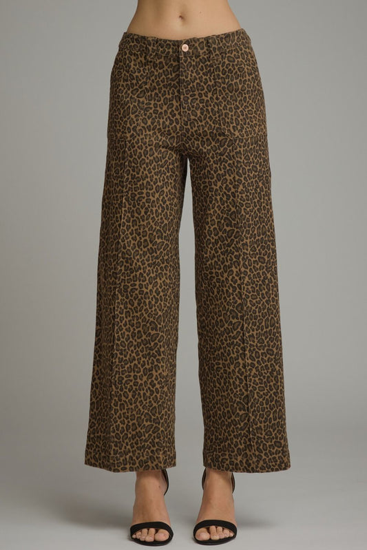 Entro- Animal print wide leg pants with belt loops and zip-fly button front closure. Front patch pockets