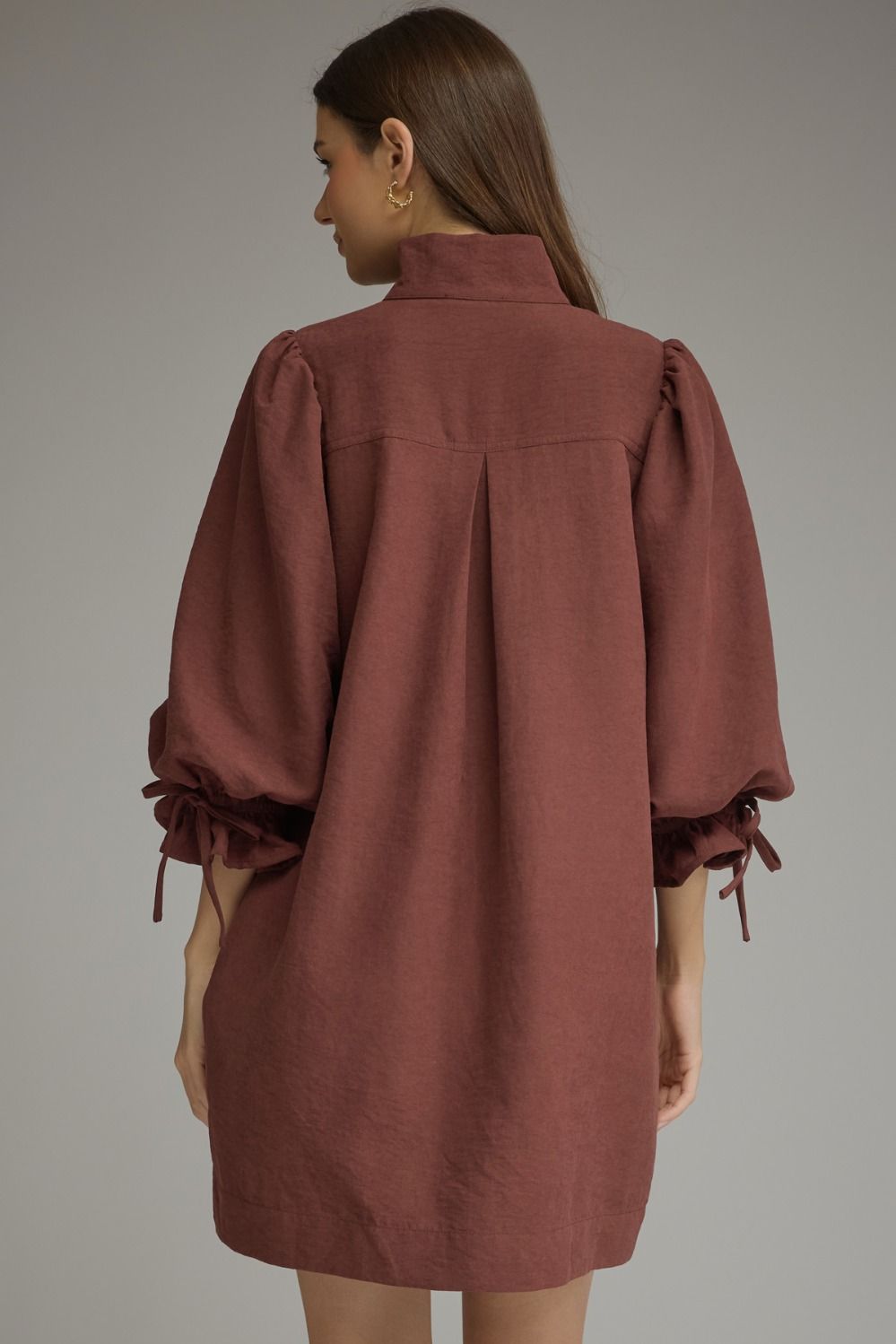 Entro-Solid ¾ balloon sleeve mini dress featuring a stand neck and button closure at front