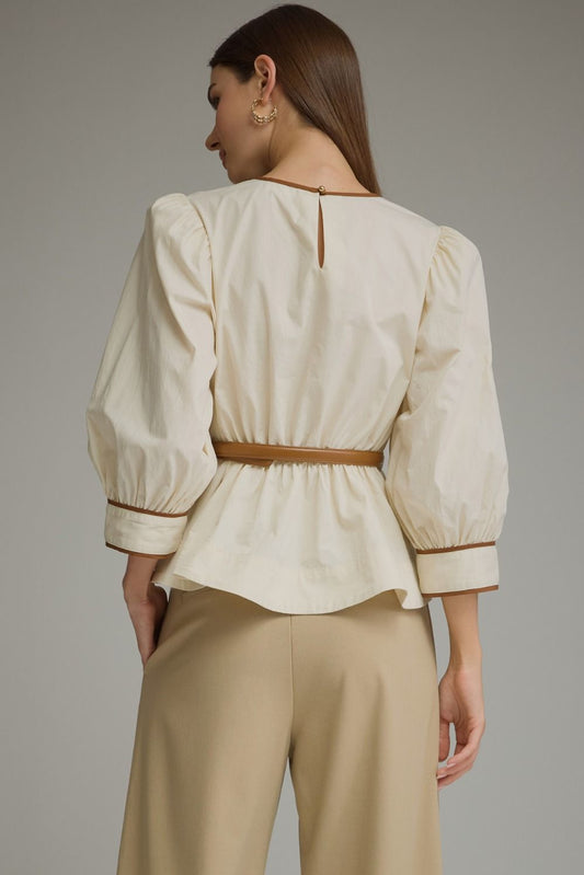 Entro-Solid long sleeve top with puff sleeves and contrast trim.