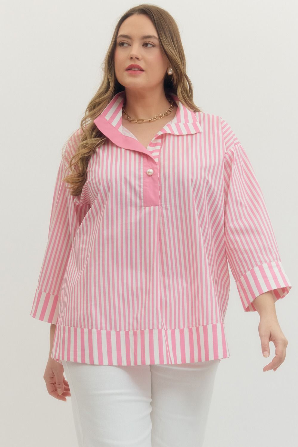 Plus Size Entro Stripe print 3/4 sleeve top featuring wide collar and pearl button at hidden placket. Button closures at cuffs. Unlined. Woven. Non-sheer. Lightweight.