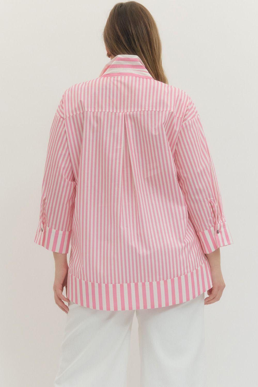 Plus Size Entro Stripe print 3/4 sleeve top featuring wide collar and pearl button at hidden placket. Button closures at cuffs. Unlined. Woven. Non-sheer. Lightweight.
