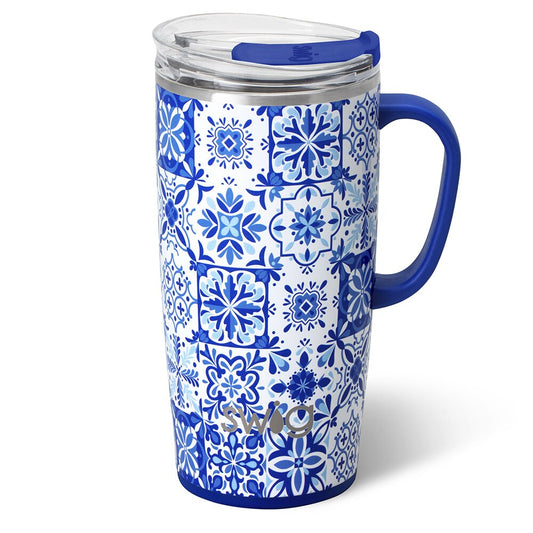 Blue and white patterned mug with a handle on a white background