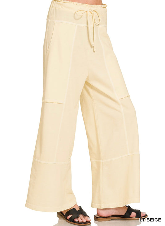 Light beige wide leg pants on a white background