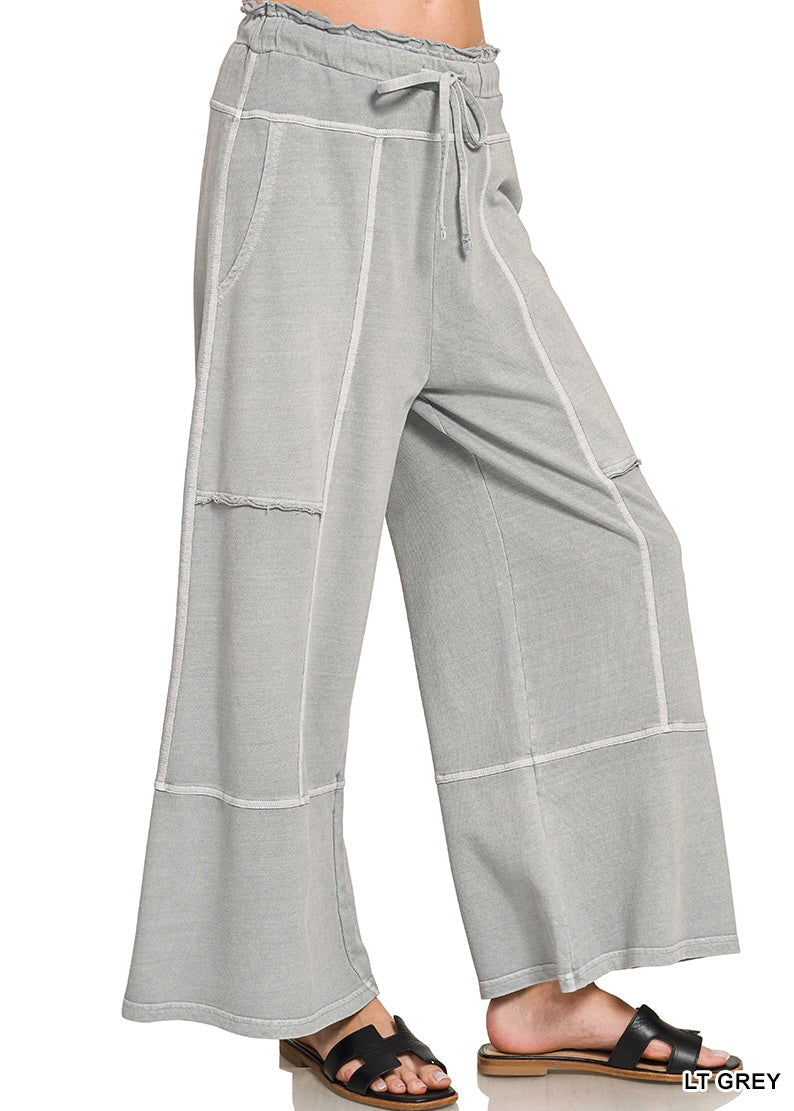 Light grey wide leg pants on a white background