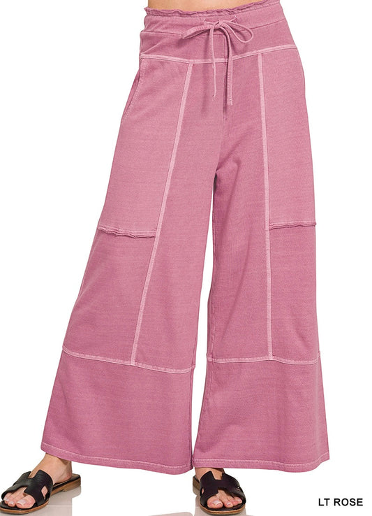 Light rose wide leg pants on a white background