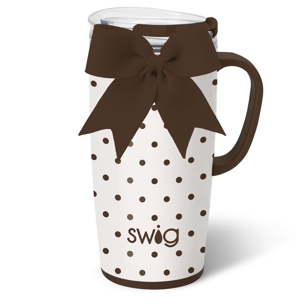 White mug with brown polka dots and a brown bow, featuring the 'Swig' brand.