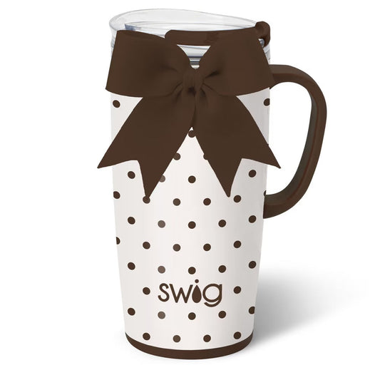 White mug with brown polka dots and a brown bow, featuring the 'Swig' brand.