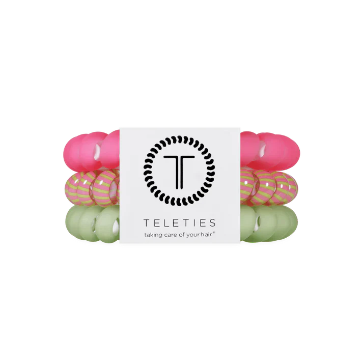Set of 3 hair ties hat are green pink and striped. 