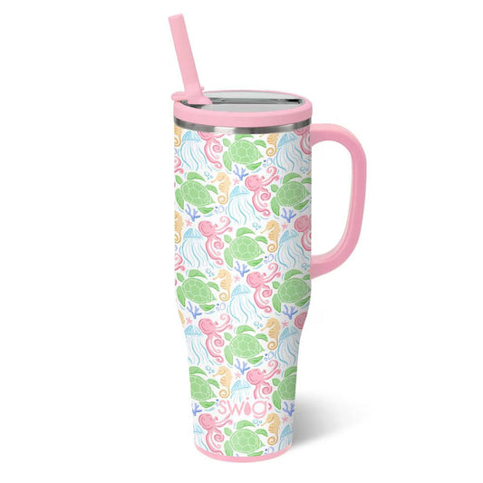 Tumbler with a turtle pattern and pink handle and straw on a white background