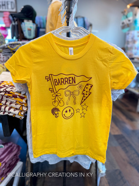 A bright yellow short-sleeve t-shirt hanging on a hanger in a retail store. The shirt features a dark burgundy graphic print with the word 'BARREN' on a banner, along with a bow, stars, a lightning bolt, and a smiley face.