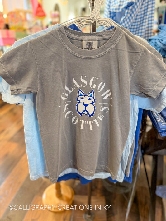 A gray short-sleeve graphic T-shirt hanging on a hanger in a retail store. The shirt features a circular white and blue 'GLASGOW SCOTTIES' design with a dog mascot logo in the center.