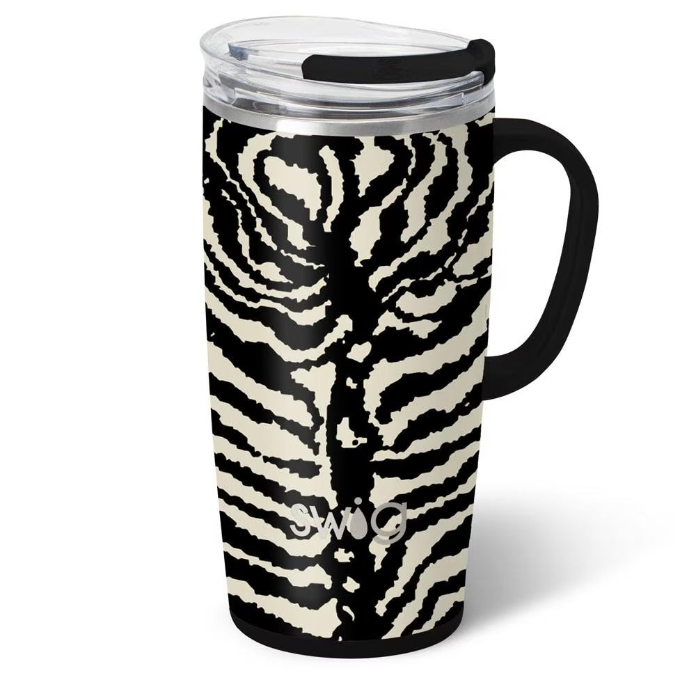 A travel tumbler with a black and cream zebra print design, featuring a black handle, black lid, and a clear plastic lid.