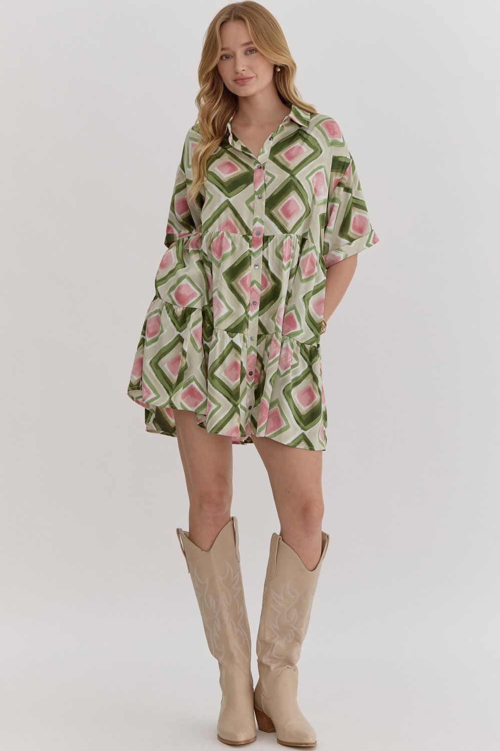 Model wearing printed tiered dress with rolled cuffs size small